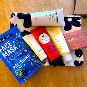 Cute denim blue and white makeup bag with some travel size items.